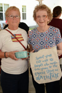 Helen Pollard (left) and Ellie Reppucci, of the Weymouth COA, enjoy the annual cookout at Allerton House at Central Park.